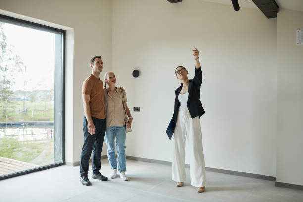 Real Estate Agent presenting House