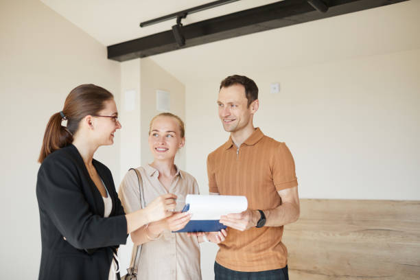 Couple Signing Contract for House