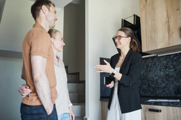 istock Couple Talking to Real Estate Agent 1330910965