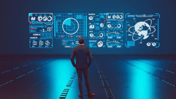 istock Big data analysis in front of a hologram screen with symbols 1330912551