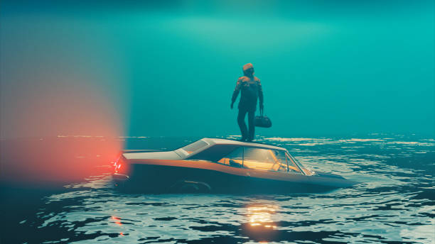 istock Car sinks into water while driver escapes and stands on the roof 1330912564