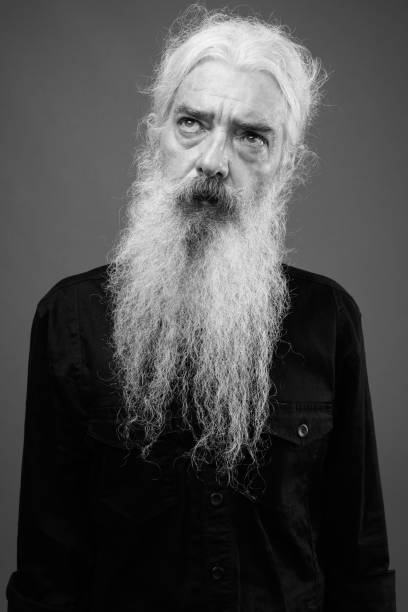 istock Senior man with long hair and beard in black and white 1330915541