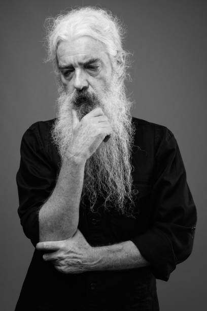 istock Senior man with long hair and beard in black and white 1330915550