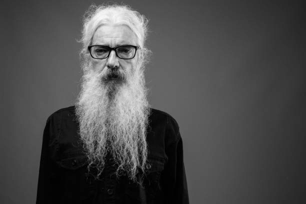 istock Senior man with long hair and beard in black and white 1330915977