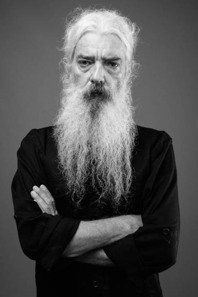 istock Senior man with long hair and beard in black and white 1330916009