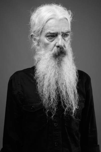 istock Senior man with long hair and beard in black and white 1330916077