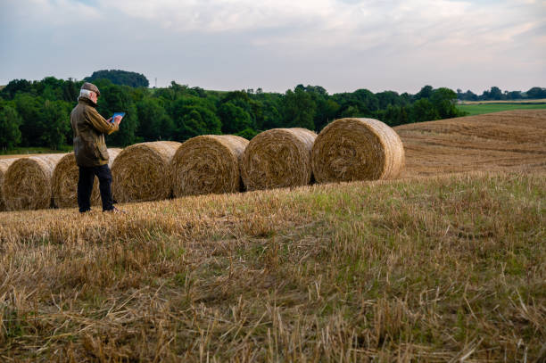 istock Mature man using digital tablet after a harvest 1330918289