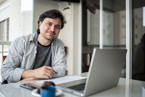 Portrait of a mature man working at home