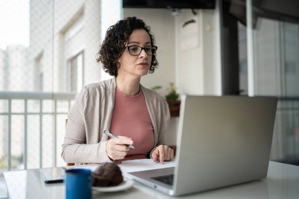 istock Woman doing a virtual business call at home 1330919342