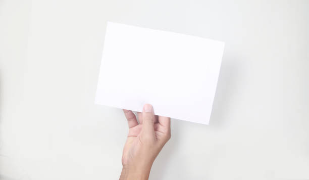 istock Hands holding paper blank for  letter paper 1330919680