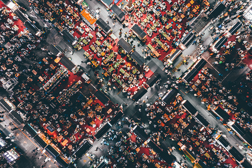 Drone Point View of Night Market and Crowd of People