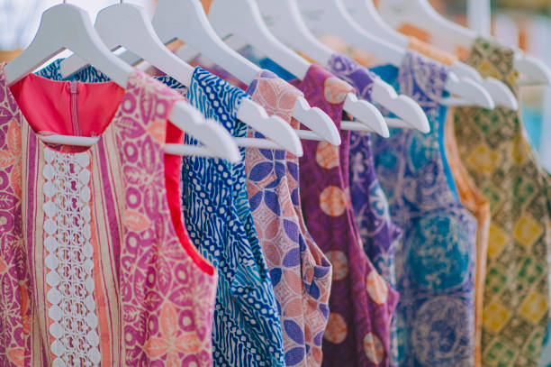 a row of sleeveless shirt Printed Batik with Hand Painted Malaysia Textile Culture a row of sleeveless shirt Printed Batik with Hand Painted Malaysia Textile Culture malaysia batik pattern stock pictures, royalty-free photos & images