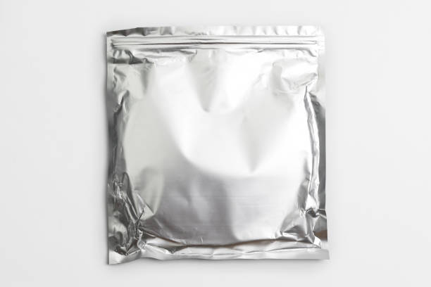 istock Foil bag package isolated on white background. Silver aluminium metallic foil doypack, packaging pouch with zipper 1330925876