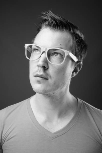 istock Young handsome man with eyeglasses in black and white 1330927082