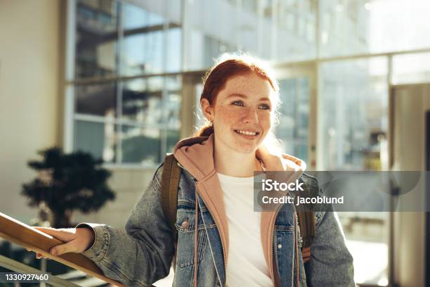 Female Student Standing In College Stock Photo - Download Image Now - Teenager, University Student, High School Student