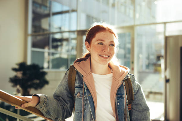 female student standing in college - high school student imagens e fotografias de stock