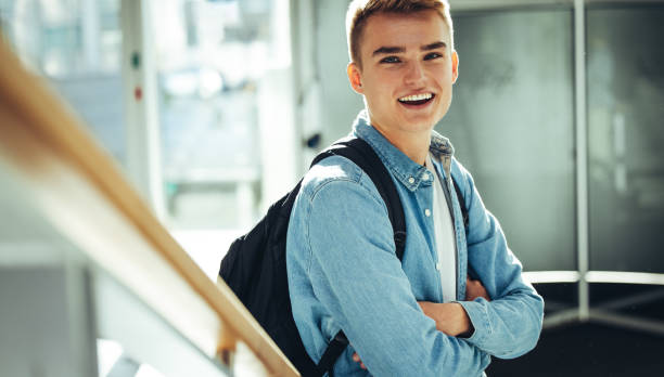 istock Happy male student in university 1330927553