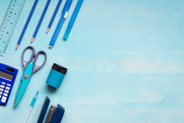 istock School and office supplies on blue 1330928353