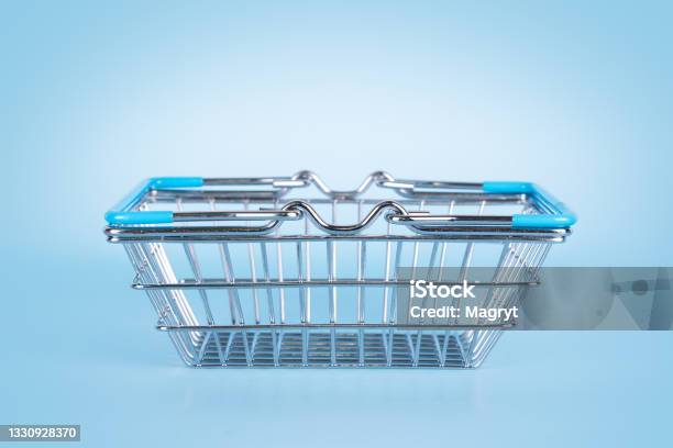 Supermarket Shopping Basket On Light Blue Background Empty Metal Wire Basket Black Friday Sale Shopping Concept Sustainable Lifestyle Stock Photo - Download Image Now
