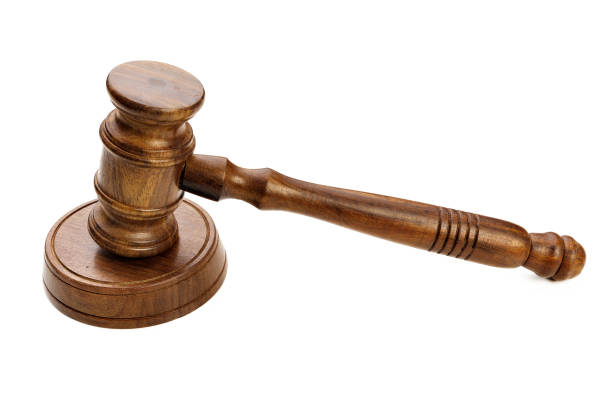 istock A wooden judge gavel isolated on white background 1330929064