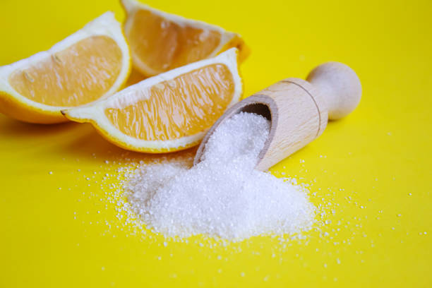 istock Citric acid on a yellow background. Selective focus. 1330929800
