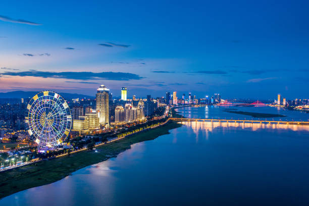 istock China city night skyline, river and buildings 1330931780