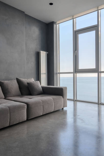 istock Living room with panoramic window and comfort couch 1330931808