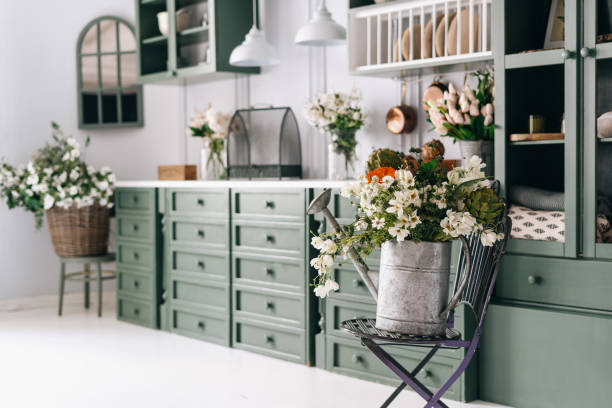 istock Kitchen in green white theme full of flowers 1330931969