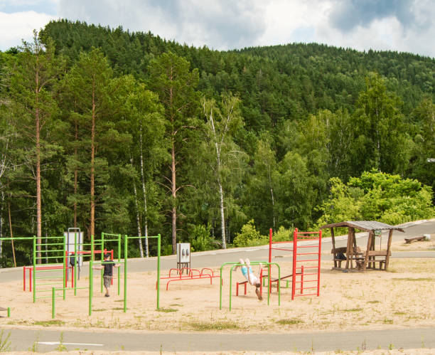 Belokurikha, Altai, RUSSIA-July 11, 2019: Panorama of the sports complex of simulators, in the middle of the forest and mountains at the resort.