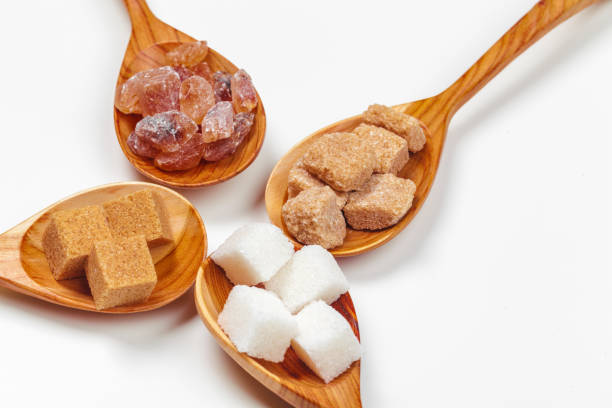 istock Different Kinds of Sugar in the Spoons close up 1330936952