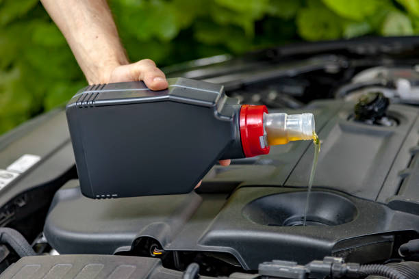 istock Car engine motor oil filling 1330938482