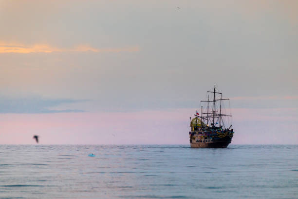 istock Ship and sunset at the seaside 1330944436