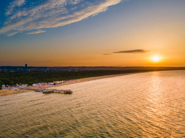 istock Pier illuminated by the sunset 1330944576