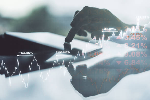 istock Multi exposure of abstract financial graph and hand working with a digital tablet on background, financial and trading concept 1330944879