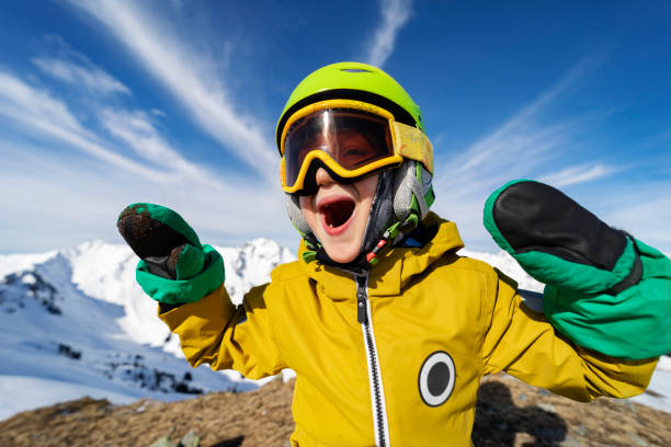 istock Little boy skiing in mountains 1330948773