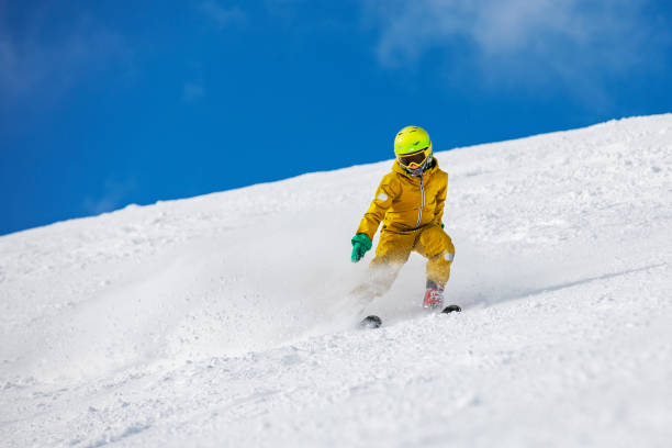 istock Little boy skiing in mountains 1330949117
