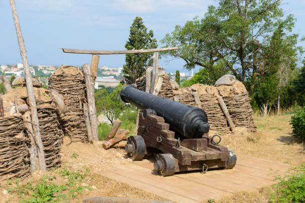 istock An old cannon with fortifications on a sunny summer day 1330949323