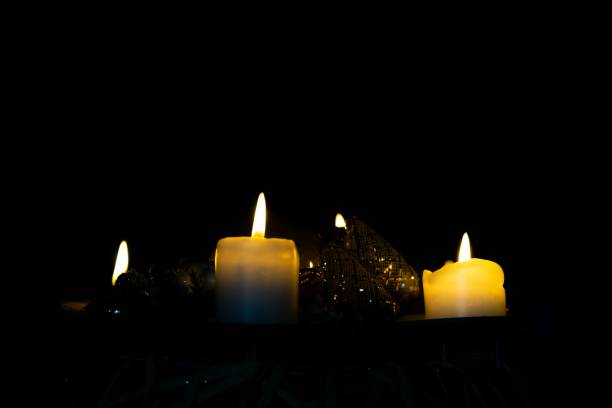 istock Candles burning in the dark. 1330949609