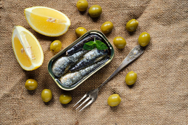 Tin of sardines in olive oil and olives