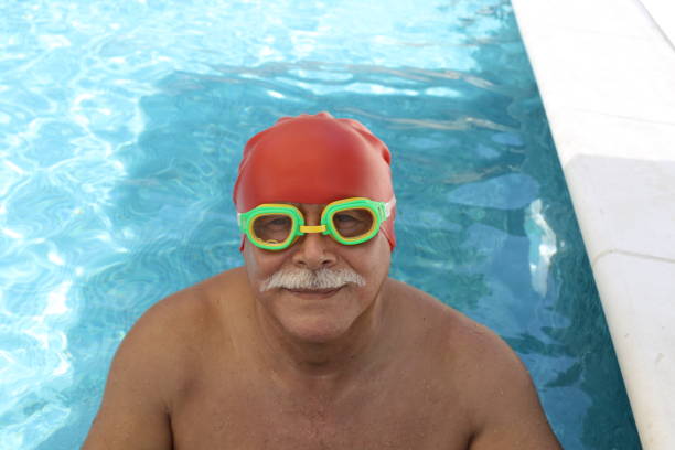 Senior male swimmer working out.