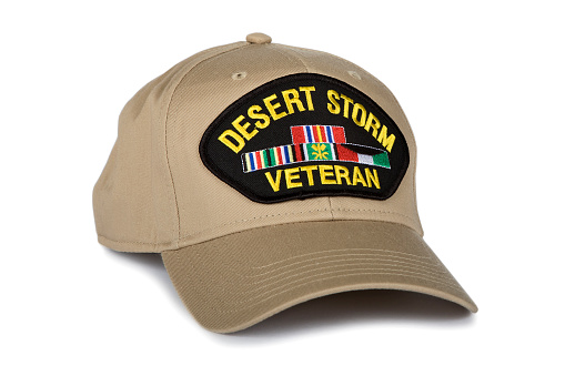 Desert Storm Veterans cap {AKA; Gulf War) inscribed with text depicting the war from January 17, 1991 – February 28, 1991. isolated on white background