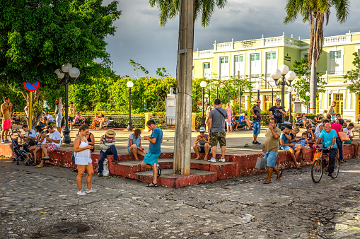 August 7, 2018 - Trinidad, Cuba: people using wifi hotspot in plaza carillo square in Trinidad, Cuba, because the limited access to internet in the island