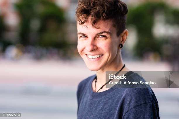 Non Binary Hispanic Transgender Mid Tomboy Androgynous Authentic Identity For Gender And Sex Education Stock Photo - Download Image Now