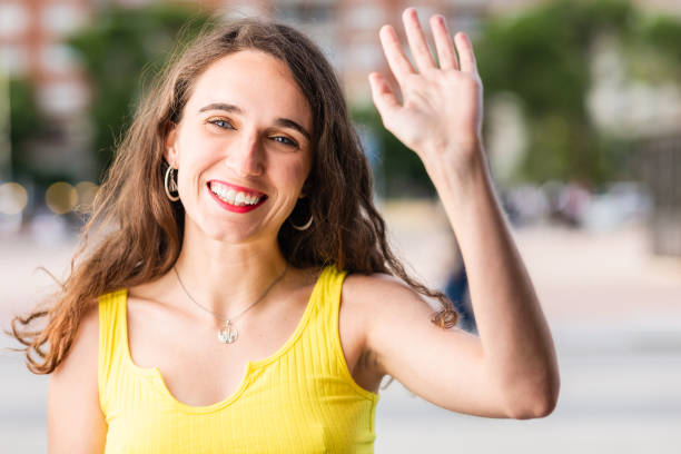 istock Hispanic young woman using talk technology chat for communication. Happy smile looking at camera 1330959335
