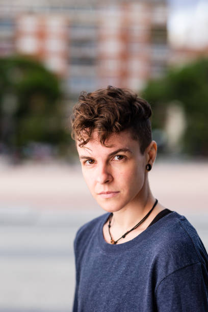 Non binary hispanic transgender mid Tomboy. Androgynous authentic identity for gender and sex education stock photo