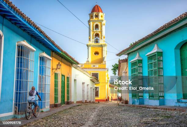 Unrecognisable Cuban Man Riding A Bike In Trinidad Cuba Stock Photo - Download Image Now