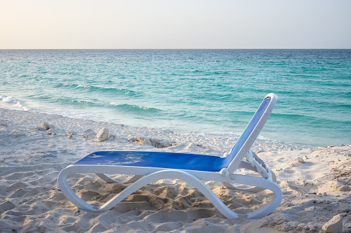 blue sun lounge in front of the caribean sea at cayo santa maria beach, cuba