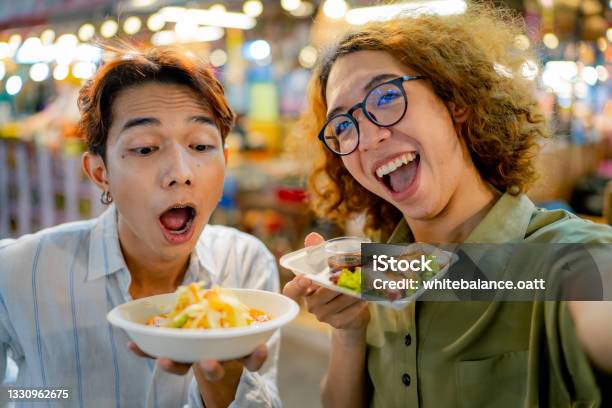 Two Vlogger Filming A Video With Their Street Food Stock Photo - Download Image Now