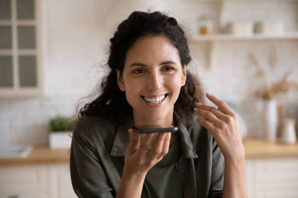 istock Young female realize internet search on phone via voice app 1330962929