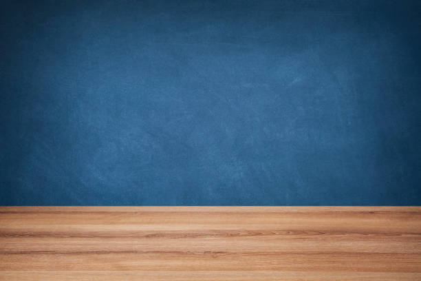 istock Blue Chalkboard and Brown Wooden Floor 1330964059